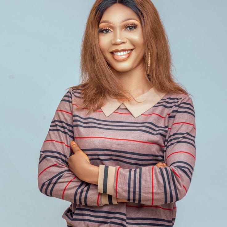 Aria Sharma, Lead Design Curator at Golden River Junction, reviewing corporate floral arrangements